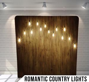 Romantic Country Lights wedding photo booth backdrop, hanging bulbs over warm wood, the golden hour look indoors